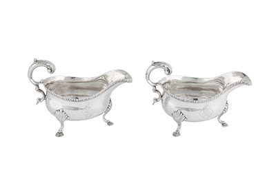 Lot 636 - A pair of George III sterling silver sauce boats, London 1773 by William Brind (this mark reg. 11th Oct 1757)