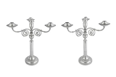 Lot 630 - A fine pair of George III sterling silver four-light candelabra, London 1800 by Robert Sharp