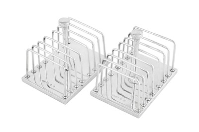 Lot 448 - A pair of Elizabeth II modernist sterling silver toast racks, London 1973 by John Alistair Donald