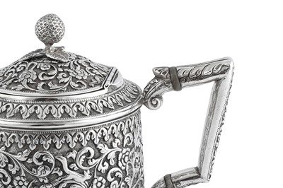 Lot 141 - A rare documentary late 19th century Anglo – Indian silver three-piece tea service, Cutch, Bhuj circa 1880 by Oomersi Mawji (active 1860-90)