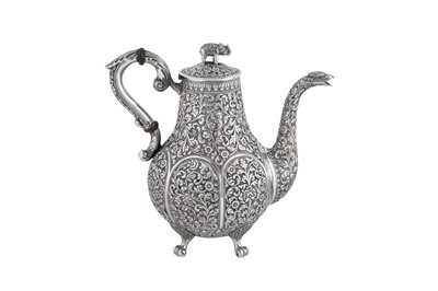 Lot 135 - A late 19th century Anglo - Indian unmarked silver coffee pot, Cutch circa 1880