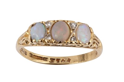 Lot 233 - A THREE STONE OPAL RING
