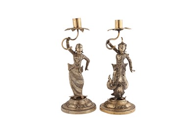 Lot 383 - A pair of heavy late 19th century Burmese silver gilt candlesticks, Thayetmyo circa 1880-1900