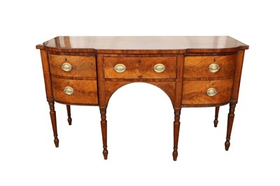 Lot 105 - A GEORGE III FLAME MAHOGANY BREAKFRONT KNEEHOLE SIDEBOARD