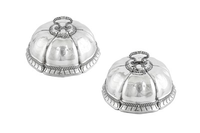 Lot 698 - Royal Ambassadorial – A pair of George III sterling silver second course dish covers, London 1771 by Thomas Heming overstriking James and Sebastian Crespell