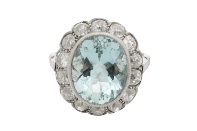 Lot 64 - An aquamarine and diamond cluster ring