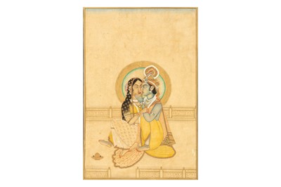 Lot 258 - KRISHNA AND RADHA IN A TENDER EMBRACE