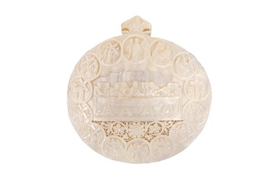 Lot 773 - λ A CARVED AND PIERCED MOTHER-OF-PEARL SHELL PLAQUE WITH CHRISTIAN ICONOGRAPHY