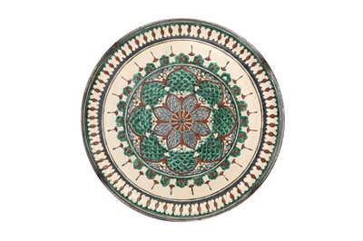 Lot 770 - AN IZNIK-STYLE POTTERY DISH WITH A SILVER RIM