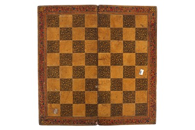 Lot 557 - A DOUBLE-SIDED LACQUERED AND GILT CHESS AND BACKGAMMON BOARD