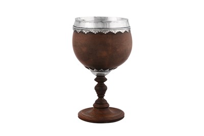 Lot 477 - A George II unmarked silver mounted coconut cup, dated 1743