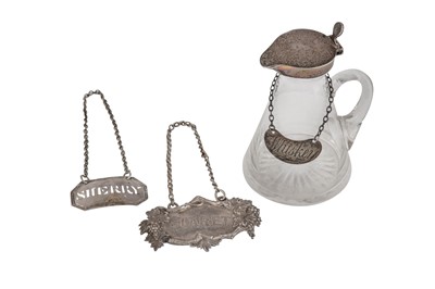 Lot 10 - AN EDWARDIAN STERLING SILVER MOUNTED GLASS WHISKEY NOGGIN, LONDON 1904 BY GOLDSMITHS AND SILVERSMITH OVERSTRIKING CARRINTON AND CO