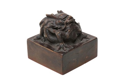 Lot 107 - A CHINESE WOOD 'DRAGON' SEAL.