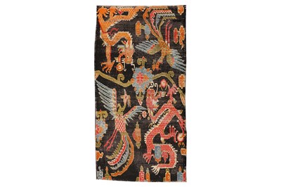 Lot 44 - AN ANTIQUE TIBETAN RUG