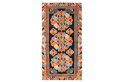 Lot 70 - AN ANTIQUE TIBETAN RUG