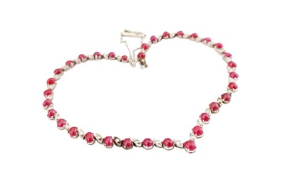 Lot 51 - An articulated ruby and diamond necklace