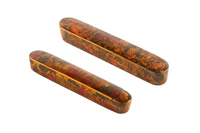 Lot 22 - TWO LACQUERED PAPIER-MÂCHÉ PEN CASES (QALAMDAN) WITH FIGURAL LITERARY SCENES