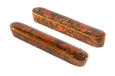 Lot 36 - TWO LACQUERED PAPIER-MÂCHÉ PEN CASES (QALAMDAN) WITH SCENIC VIEWS AND GOL-O-BOLBOL MOTIFS