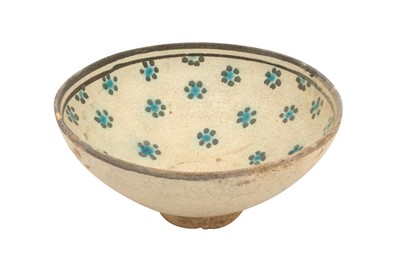 Lot 3 - A KASHAN TURQUOISE AND BLACK POTTERY BOWL WITH ROSETTES