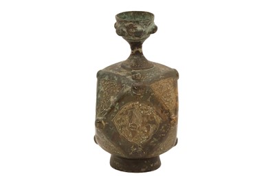 Lot 6 - A SMALL ENGRAVED AND FACETED BRONZE BOTTLE