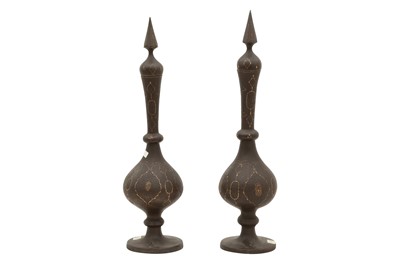 Lot 61 - A NEAR PAIR OF QAJAR GOLD-DAMASCENED STEEL BOTTLES WITH STOPPERS
