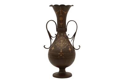 Lot 64 - A MONUMENTAL QAJAR GOLD-DAMASCENED STEEL TWO-HANDLED BALUSTER VASE