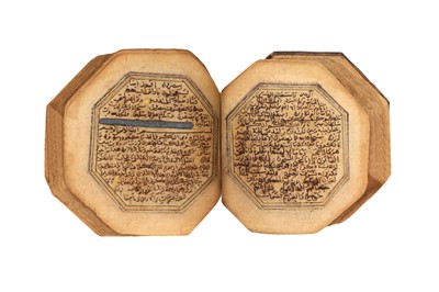 Lot 55 - A SECTION FROM AN OCTAGONAL OTTOMAN MINIATURE QUR'AN, SURA AN-NABA (78) TO THE END