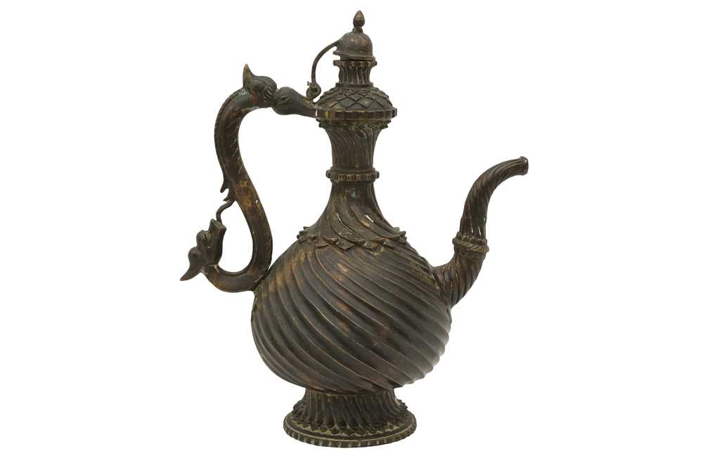 310 - A BRONZE EWER (AFTABA) WITH MAKARA HANDLE