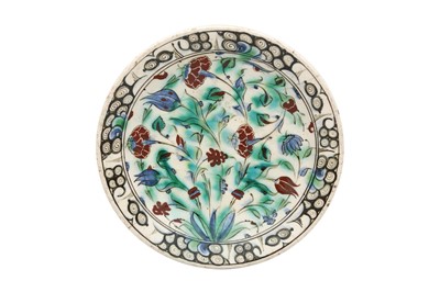 Lot 496 - AN IZNIK POTTERY DISH WITH FLORAL MOTIFS