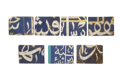 Lot 482 - SEVEN CALLIGRAPHIC CUERDA SECA POTTERY TILES