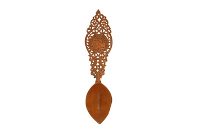 Lot 461 - AN IRANIAN FRUITWOOD SPOON WITH THE SHIR-O-KHORSHID SYMBOL