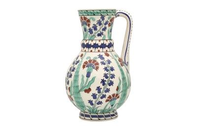 Lot 498 - AN IZNIK-STYLE BFK POTTERY JUG