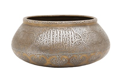 Lot 527 - A FINELY ENGRAVED AND SILVER-INLAID FARS BRASS BOWL