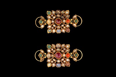 Lot 376 - λ A PAIR OF ENAMELLED GOLD NINE-GEM (NAVRATNA) ARMLETS (BAZUBAND)