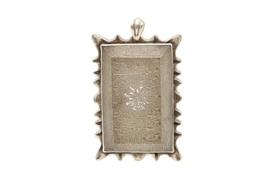 Lot 441 - A SILVER-MOUNTED ENGRAVED ROCK CRYSTAL PENDANT