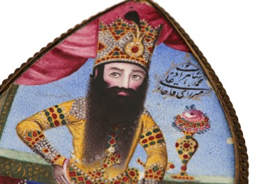 Lot 446 - A POLYCHROME-ENAMELLED PORTRAIT MEDALLION OF FATH ALI SHAH'S SON, MUHAMMAD ALI MIRZA QAJAR