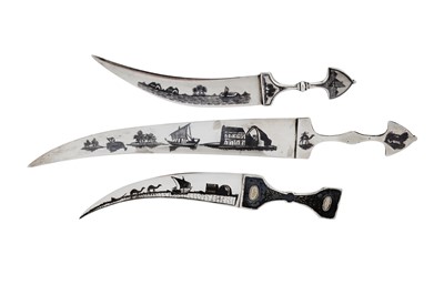 Lot 443 - Three early to mid-20th century Iraqi silver and niello paper knives, Omara circa 1940