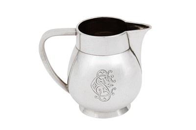 Lot 473 - An Alexander III Russian 84 zolotnik (875 standard) silver milk jug, Saint Petersburg 1882 by Johan Ferdinand Olsonins (Finnish 1823 – 1888), retailed by Grachev Brothers (est. 1866)