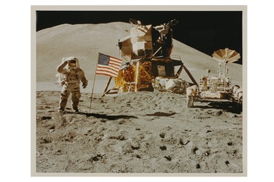 Lot 437 - Apollo 15 Lunar Module Pilot James Irwin salutes the U.S. flag.