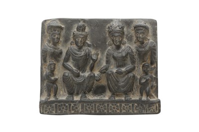 Lot 299 - A GREY SCHIST FIGURAL RELIEF FRAGMENT