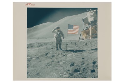 Lot 432 - Apollo 15: Astronaut David Scott gives salute beside U.S. Flag