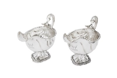 Lot 675 - A pair of George III sterling silver sauceboats, London 1767 by David Whyte & William Holmes
