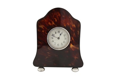 Lot 346 - An Edwardian silver mounted tortoiseshell timepiece / mantel clock, London 1906 by HA
