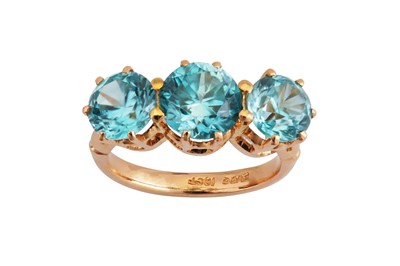 Lot 73 - A three-stone blue zircon ring