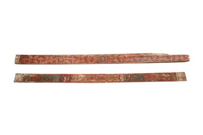 Lot 516 - TWO MUDEJAR POLYCHROME-PAINTED WOODEN BEAMS WITH SPANISH COATS OF ARMS