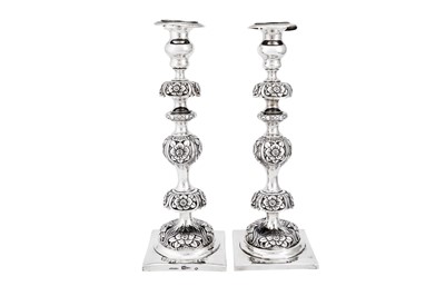 Lot 474 - A pair of Alexander II late 19th century Russian 84 zolotnik (875 standard) silver sabbath candlesticks, Minsk 1871 by R. Szyldborg