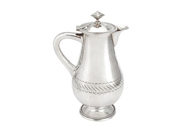 Lot 332 - A George V ‘Arts and Crafts’ sterling silver wine flagon or ewer, Birmingham 1922 by William Bernard Wood