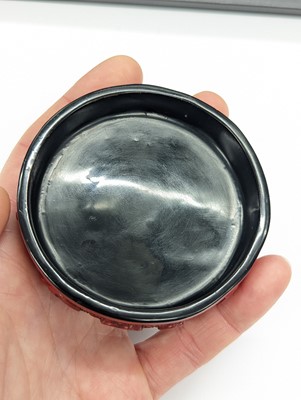 Lot 68 - A CHINESE CINNABAR LACQUER 'LYCHEE' CIRCULAR SEAL PASTE BOX AND COVER