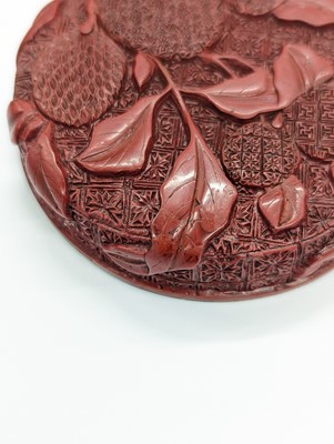 Lot 68 - A CHINESE CINNABAR LACQUER 'LYCHEE' CIRCULAR SEAL PASTE BOX AND COVER
