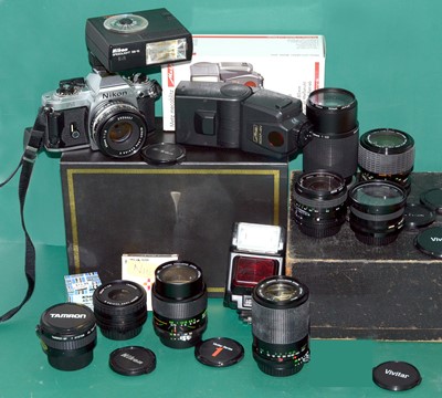 Lot 37 - An Extensive Nikon FG Film Camera Outfit.